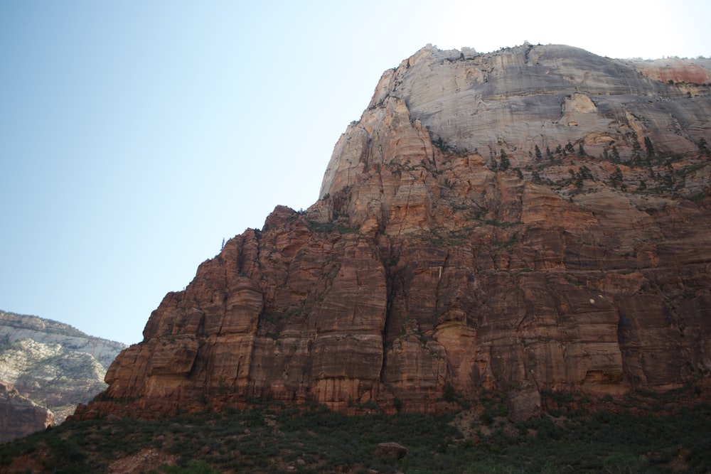 brown rock formation under blue sky during daytime