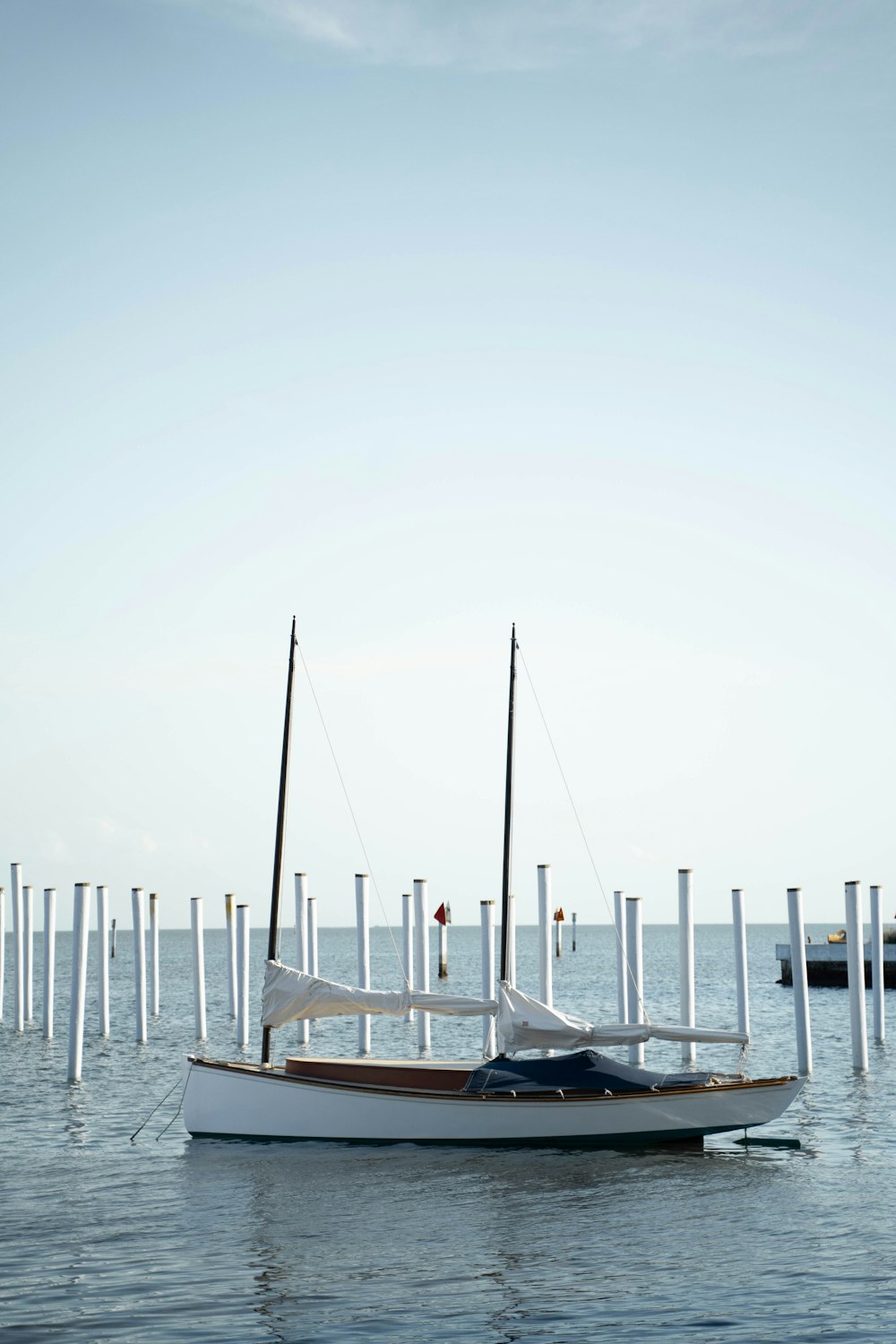 white and blue boat on sea during daytime