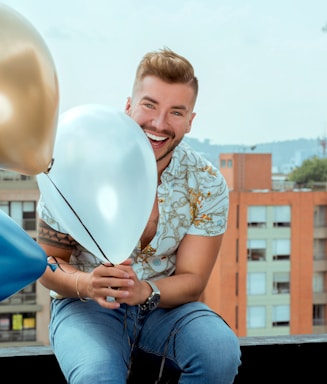A cheerful customer service representative holding a balloon bouquet, smiling warmly.