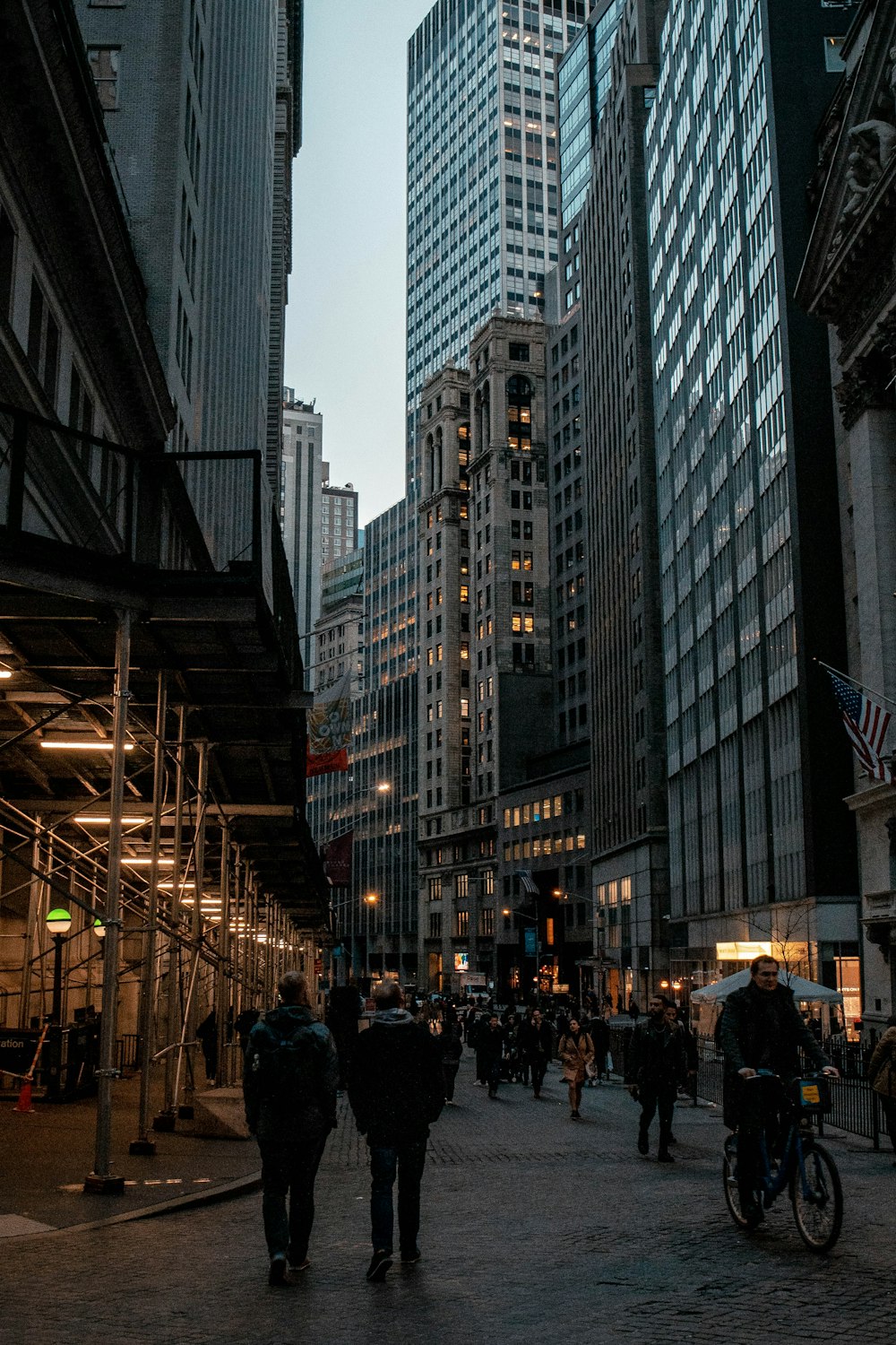 people walking on street near high rise buildings during daytime