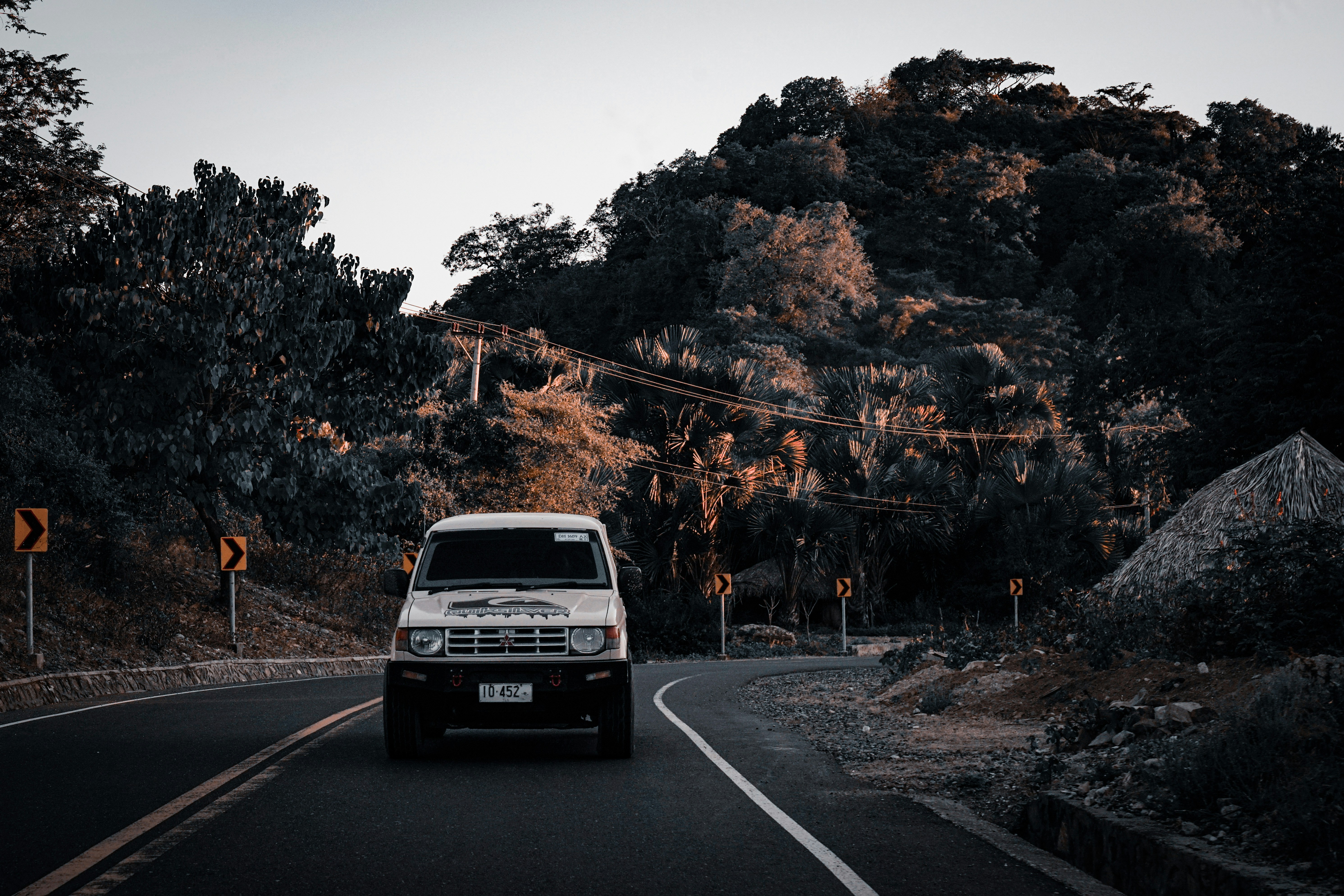 black car on road near trees during daytime timor-leste teams background