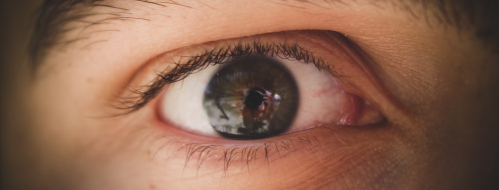 persons eye in close up photography