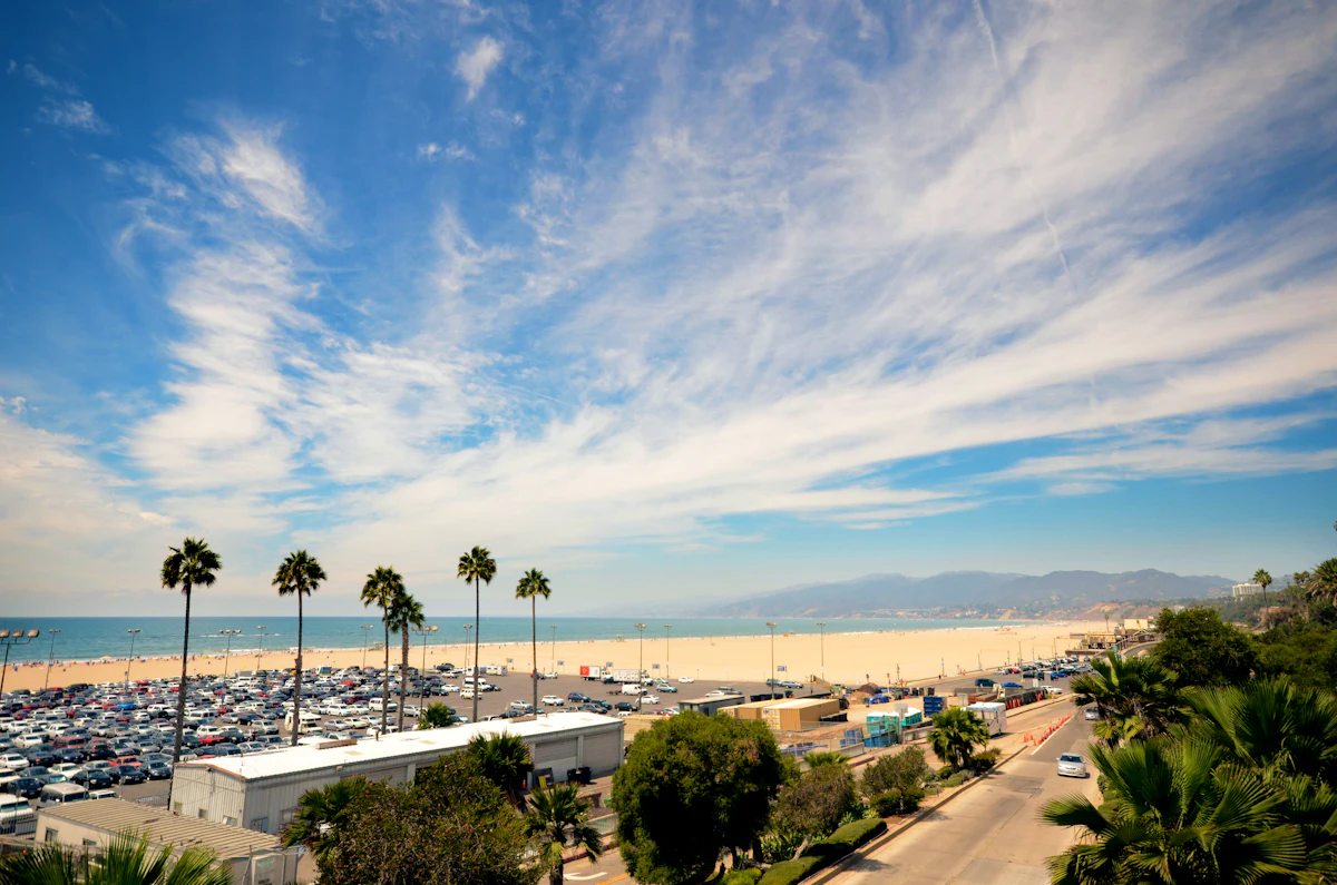 White condo building surrounded by palm trees in Los Angeles