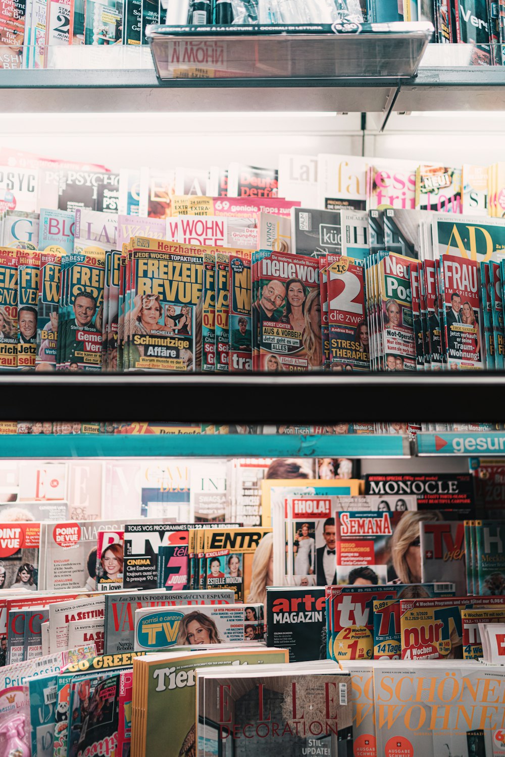 kanji text print magazine on black metal shelf