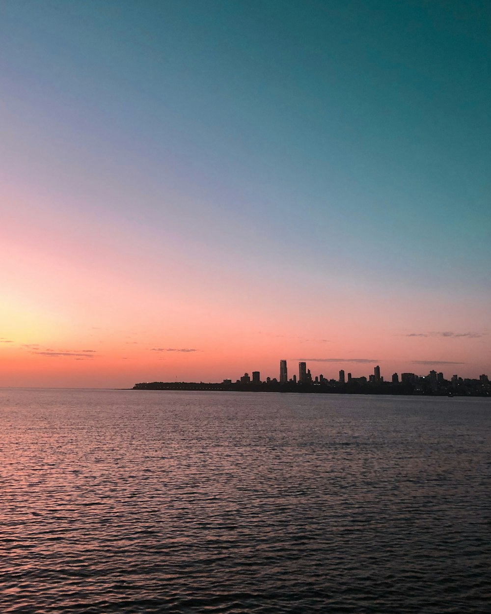 silhouette of island during sunset