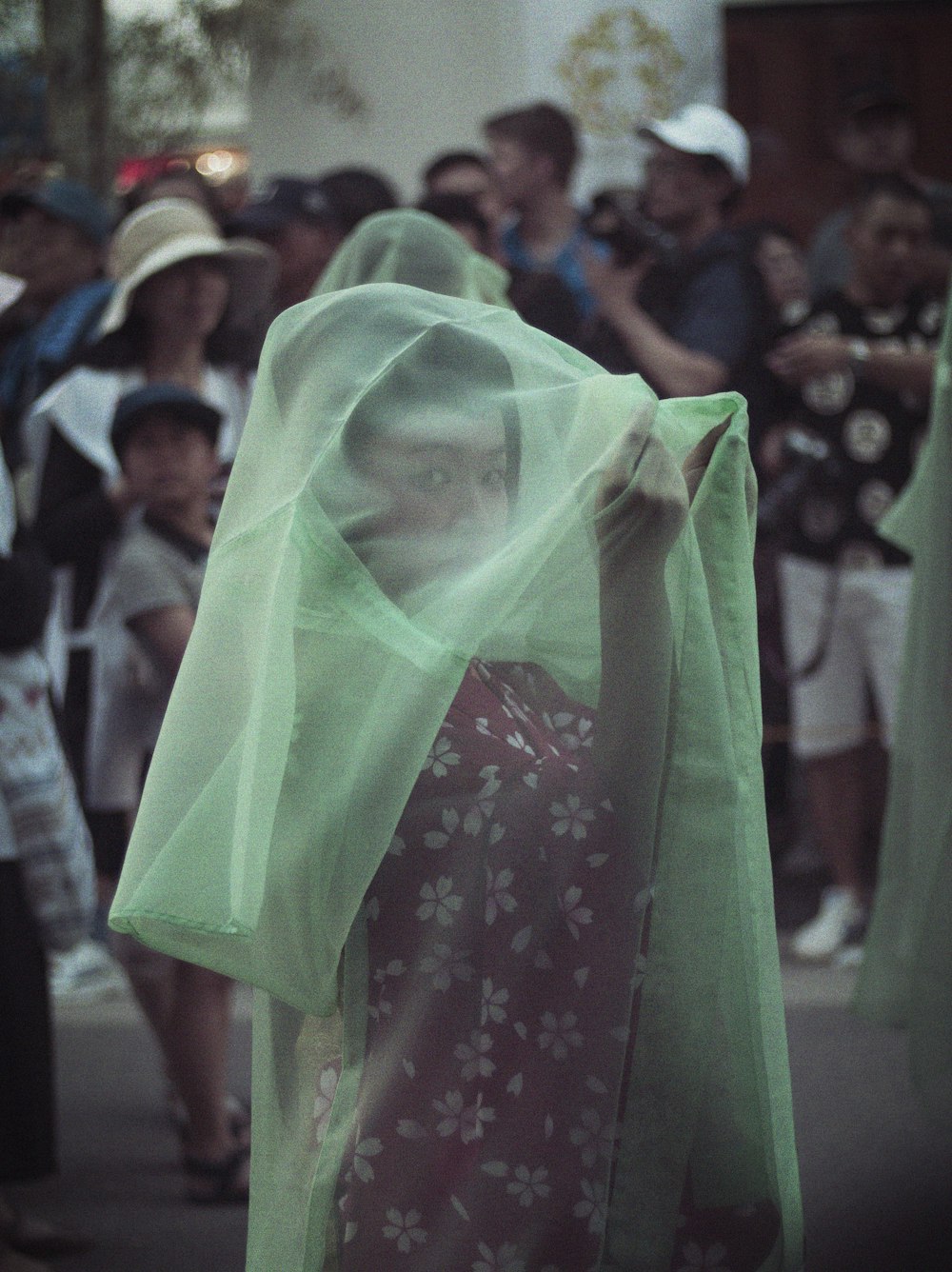 woman in green hijab standing