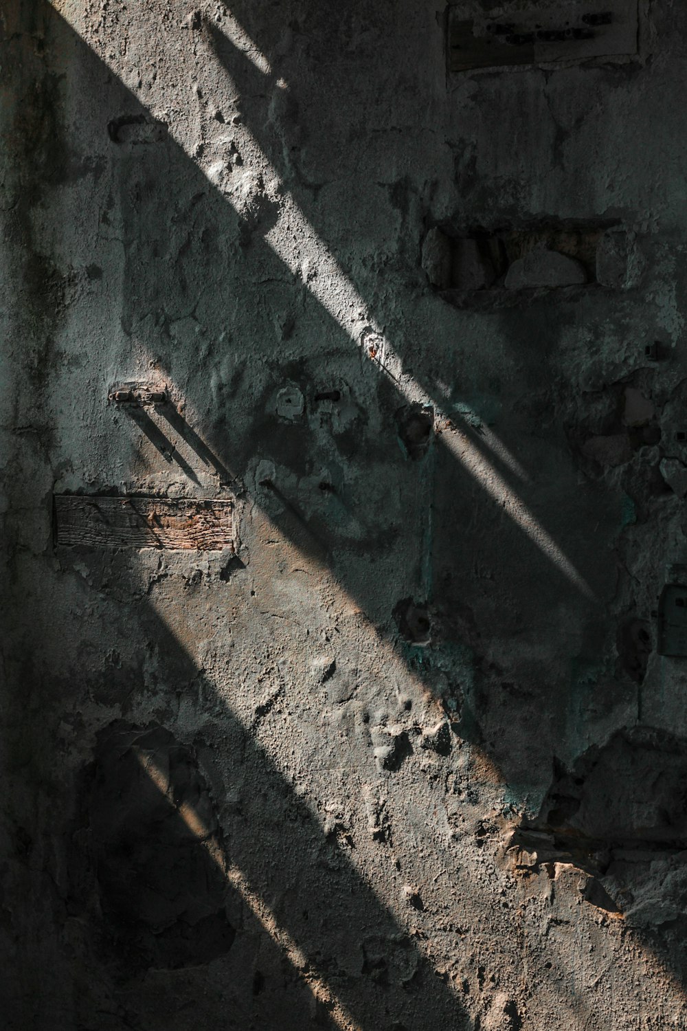 gray metal ladder on gray concrete wall