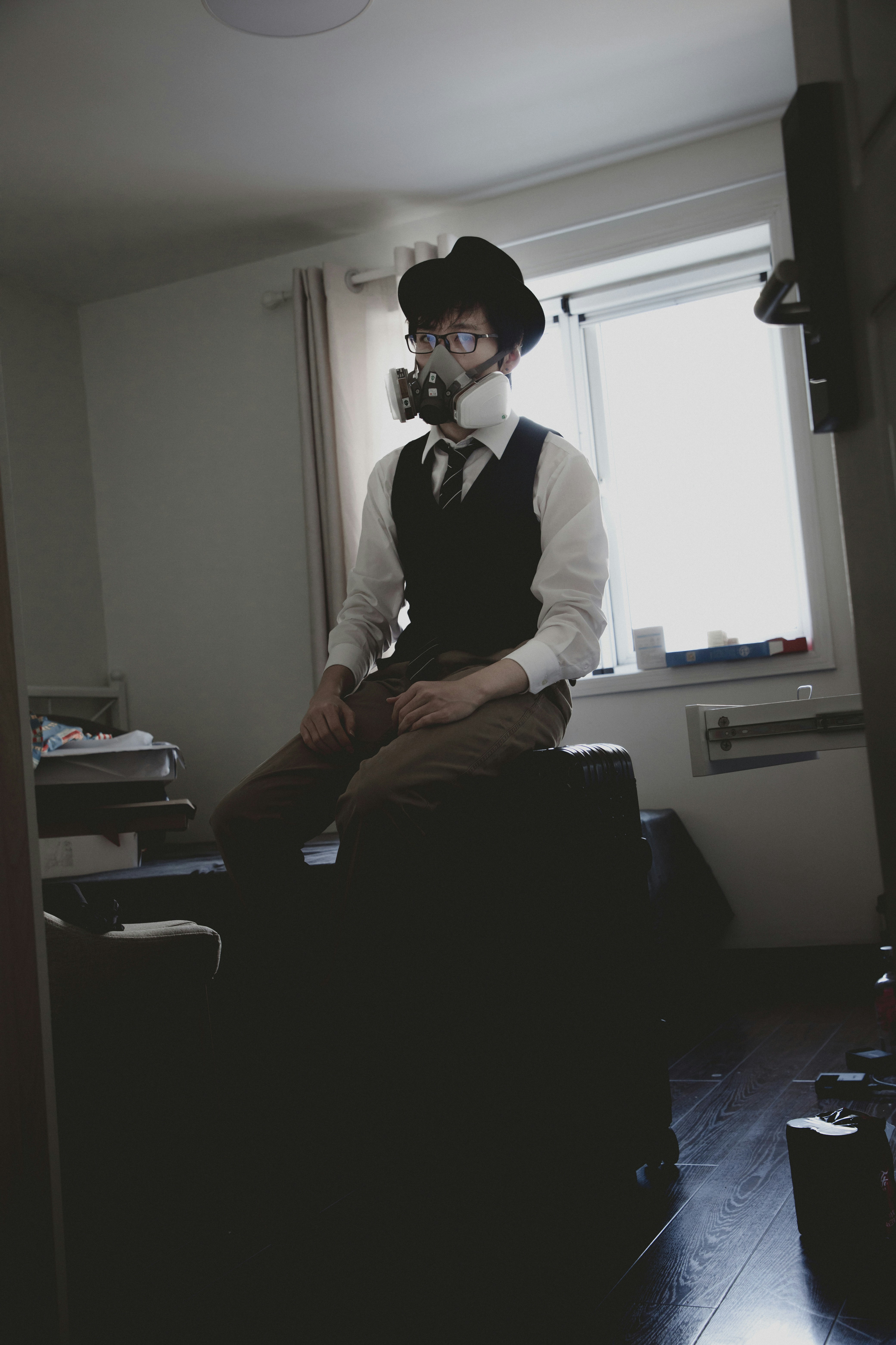 man in white dress shirt sitting on black office rolling chair