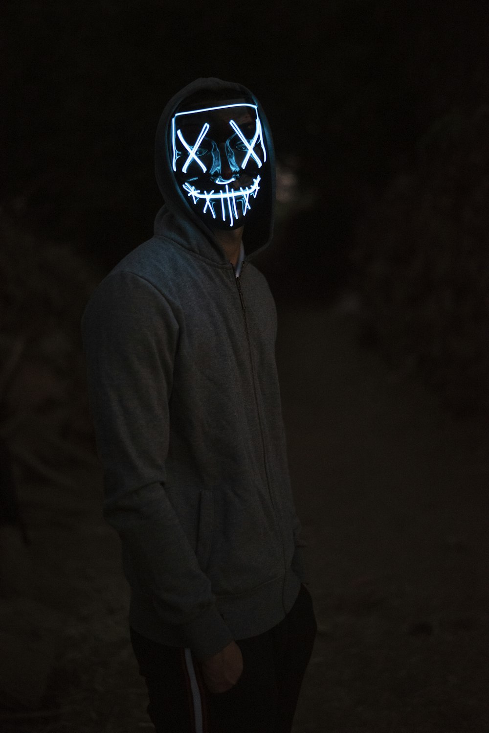 person in black and white mask
