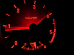 black and red speedometer at 0