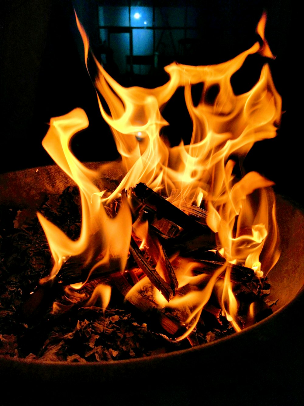 fire in black round container