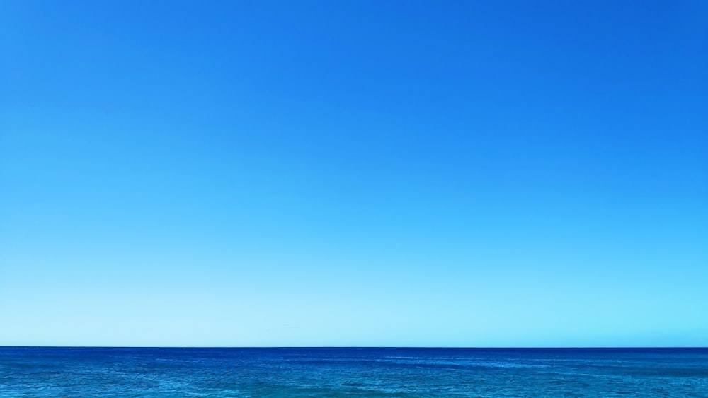 blue ocean under blue sky during daytime