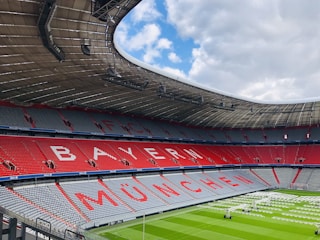 red and white stadium under blue sky during daytime
