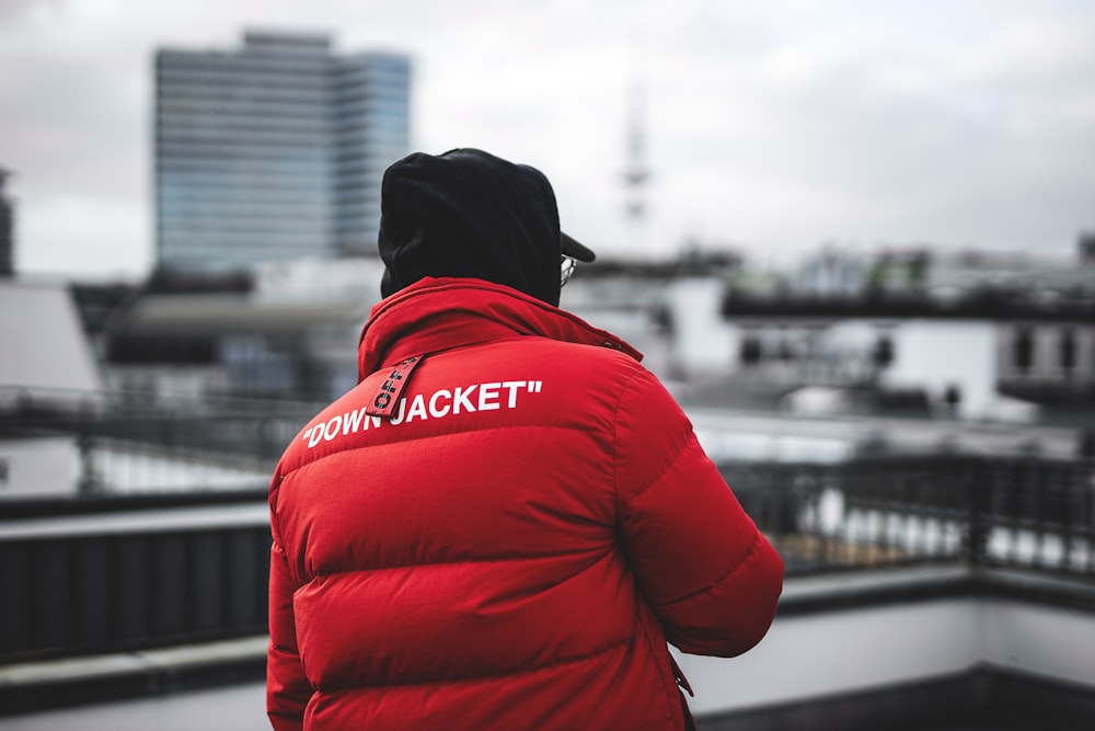 person in red jacket and black knit cap