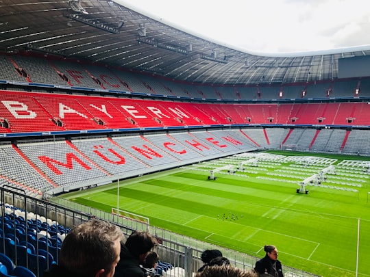 people watching football game during daytime in Allianz Arena Germany