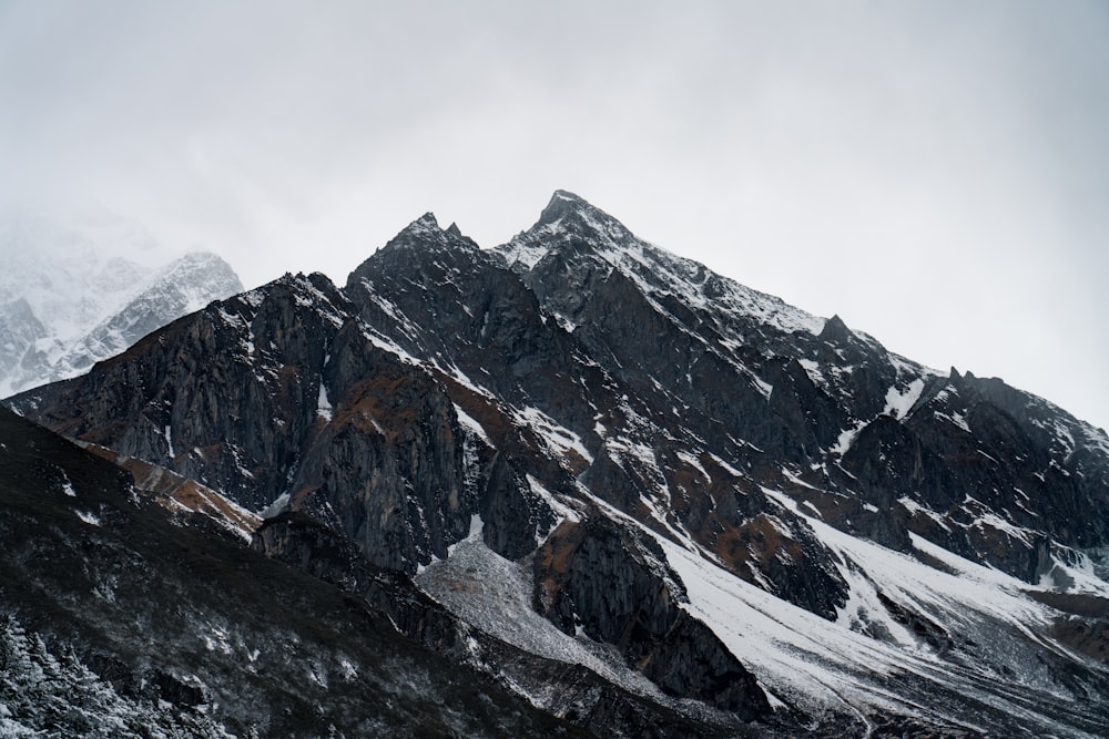 gray and white mountain under white sky during daytime