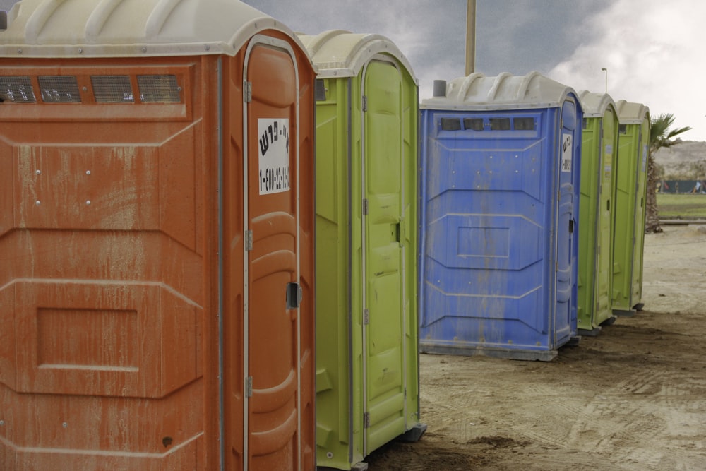 red and blue plastic trash bins