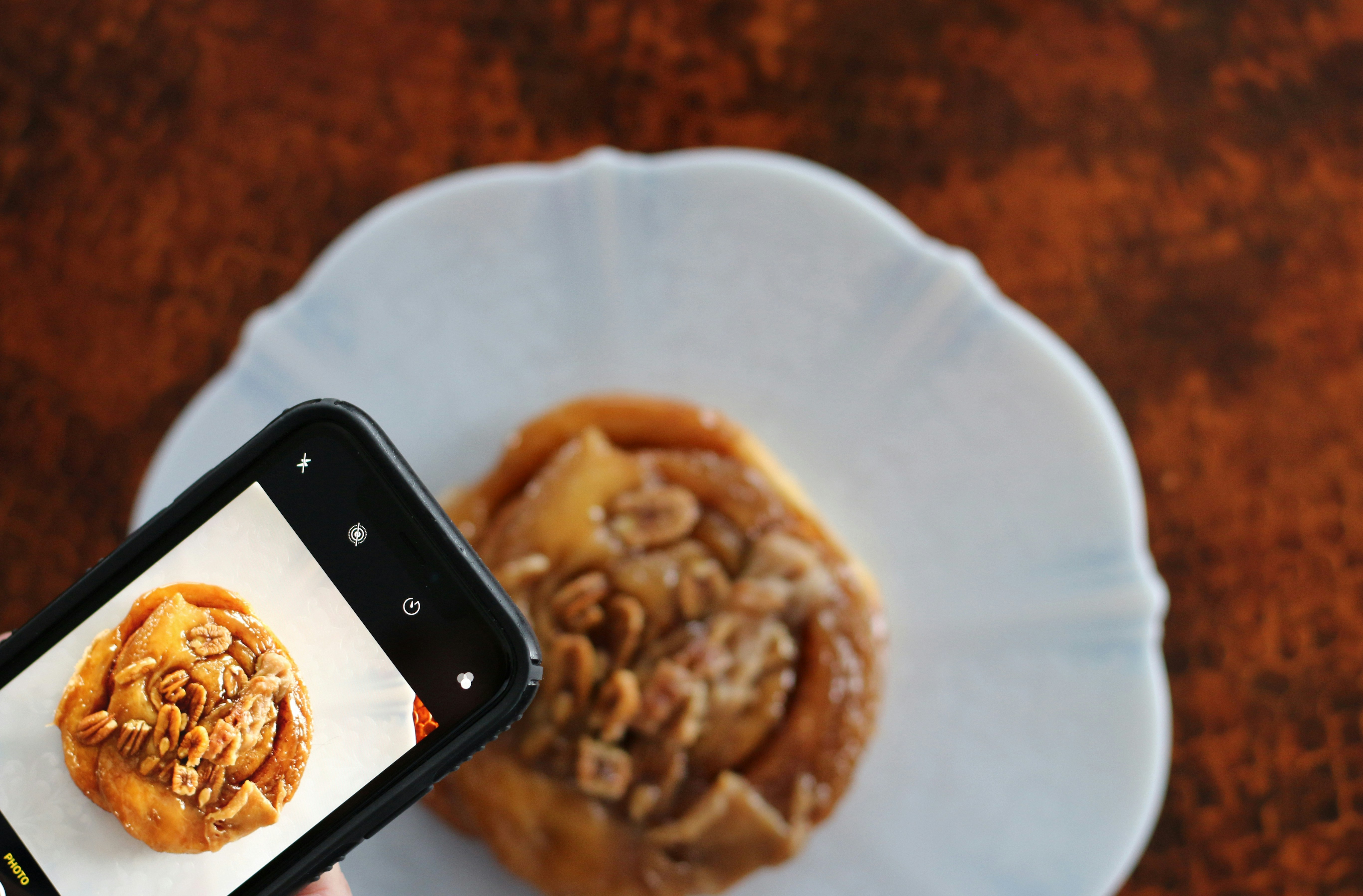 black iphone 5 on white ceramic plate