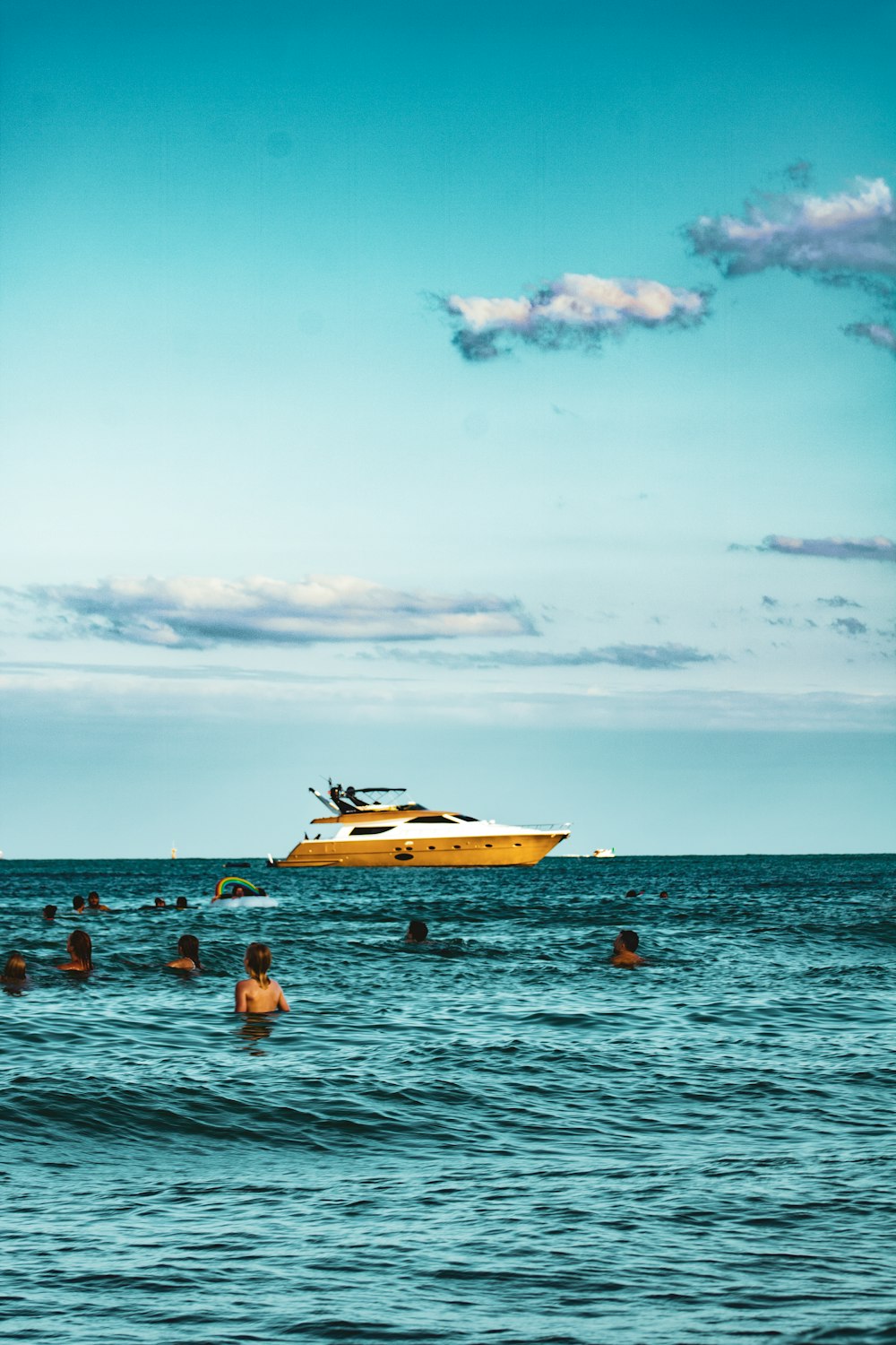 people in the sea during daytime