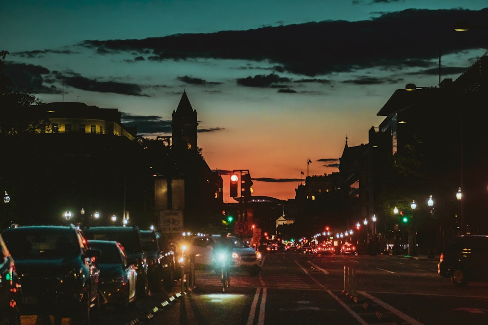 cars parked on side of road during night time