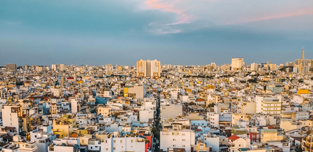 city with high rise buildings under blue sky during daytime