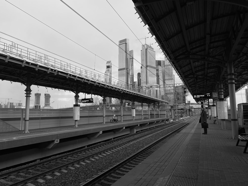 grayscale photo of train rail