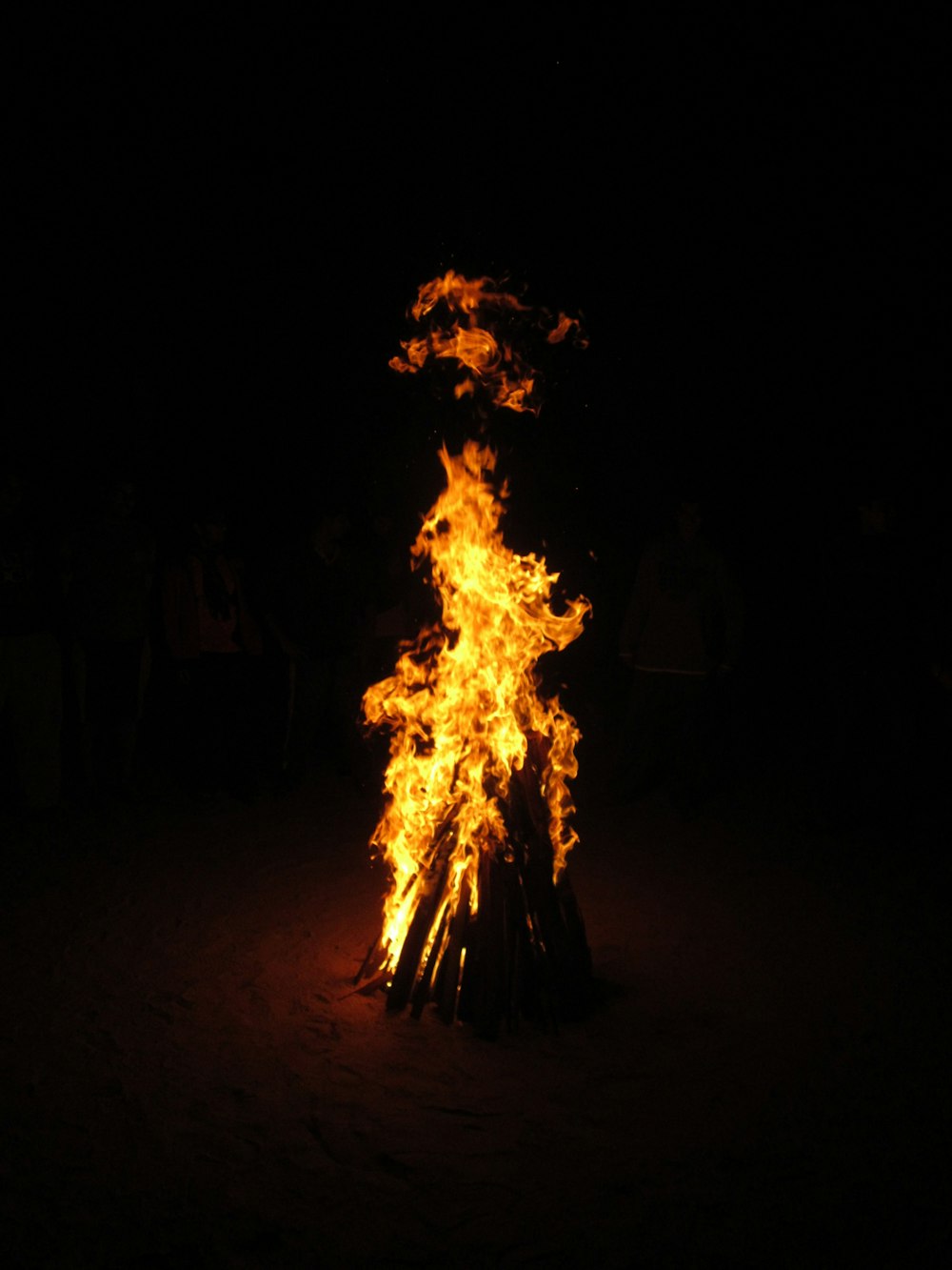 bonfire in the middle of the field during night time