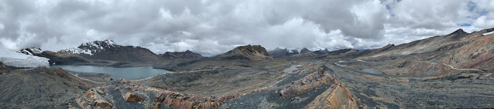 brown and green mountain under white clouds during daytime