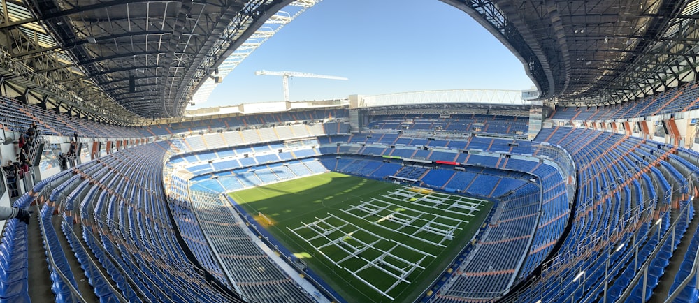 green soccer field under blue sky during daytime