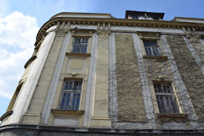 Exterior shot of a renovated historic building used by a charity, highlighting its restored facade.