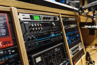 black audio mixer in brown wooden shelf
