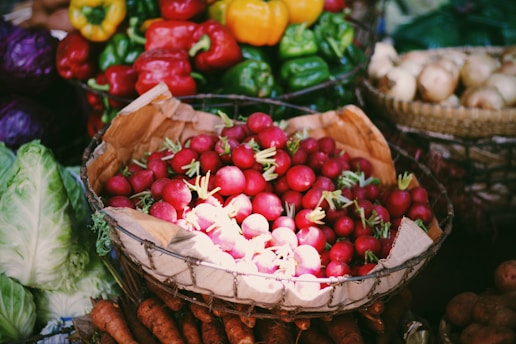 red and yellow bell peppers on white ceramic bowl