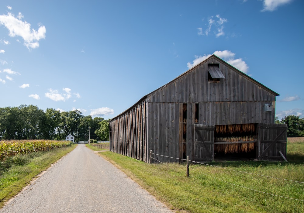 brown wooden barn under blue sky during daytime