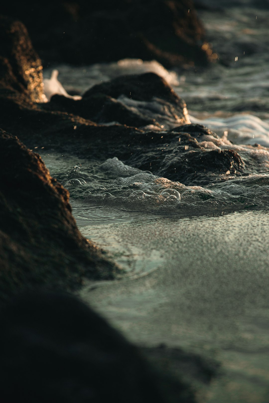 brown rock formation on sea shore during daytime