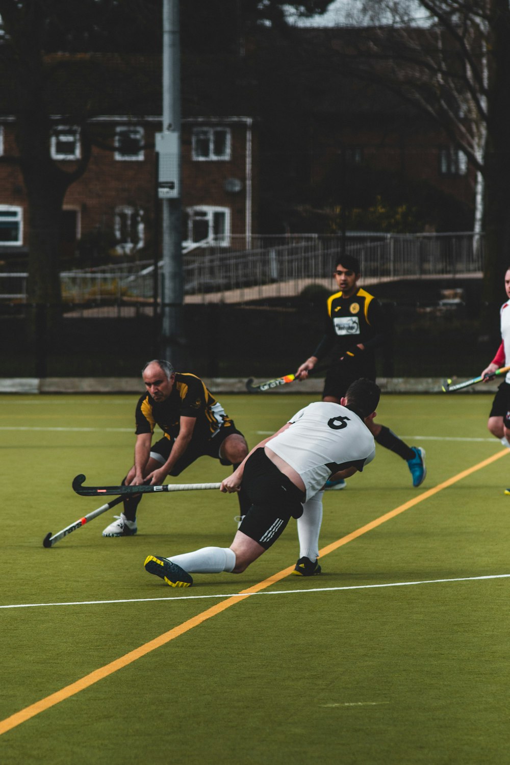 2 men playing cricket on field during daytime