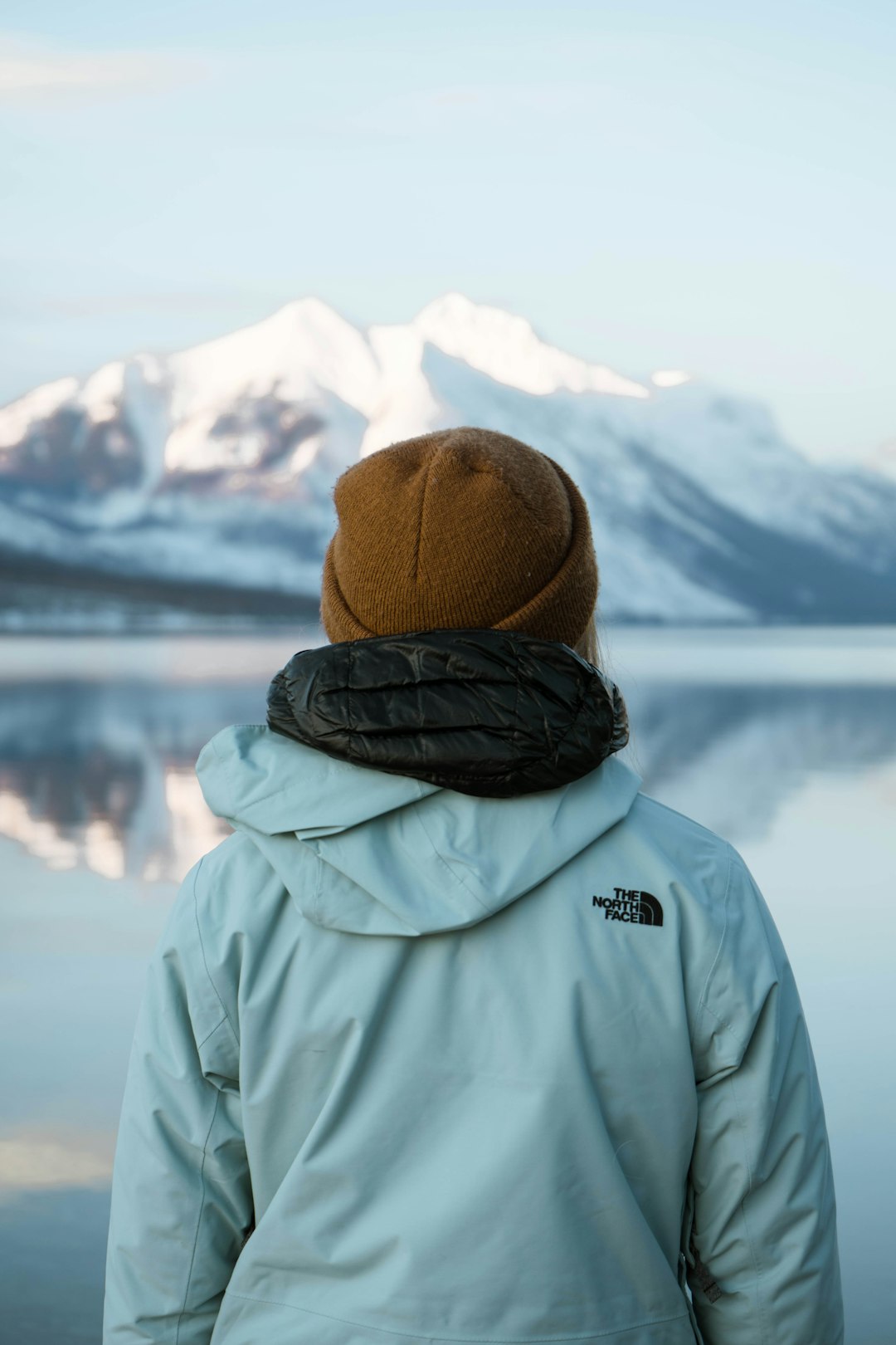 person in gray jacket and brown knit cap