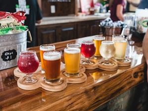 clear drinking glasses on brown wooden table