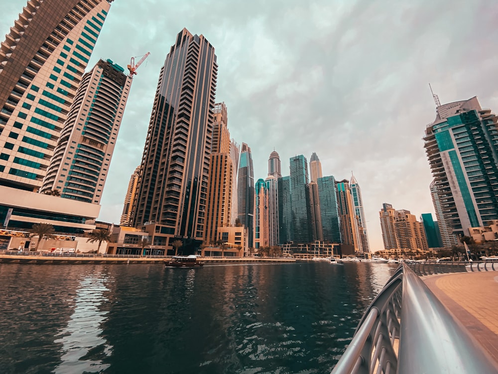 high rise buildings near body of water during daytime