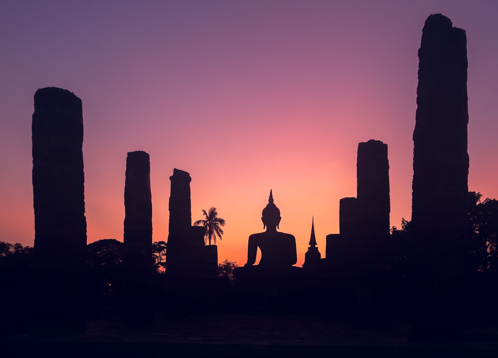 silhouette of statue during sunset