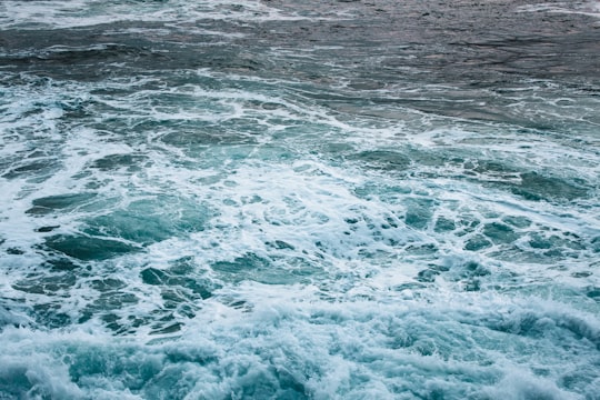 ocean waves crashing on shore during daytime in San Sebastián Spain