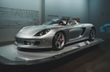 silver mercedes benz coupe in a room