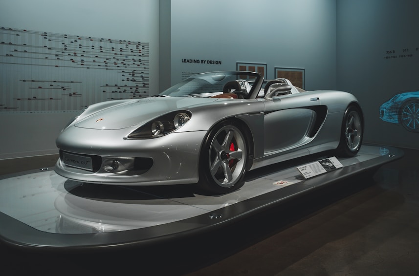 silver mercedes benz coupe in a room