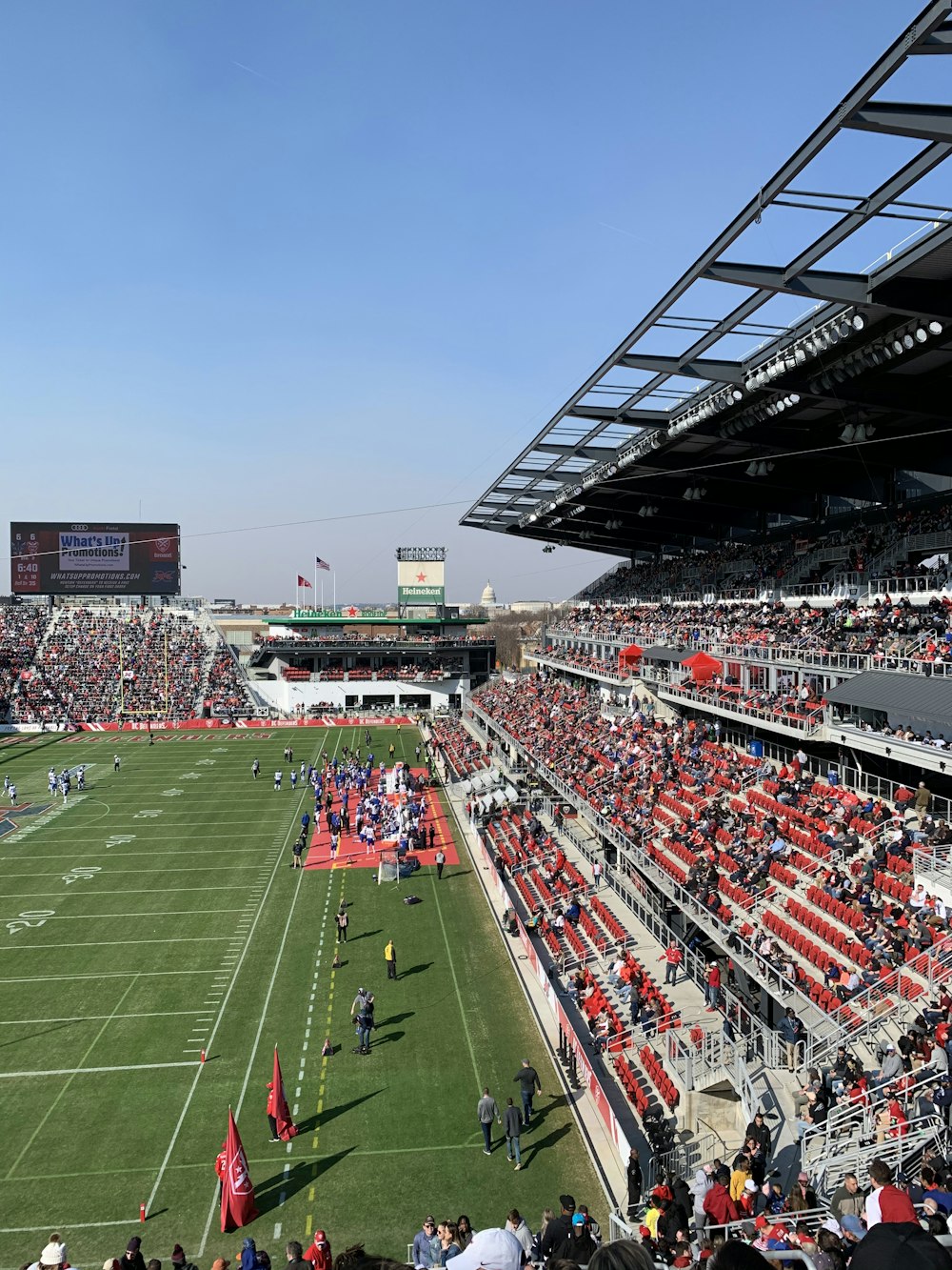 people on football stadium during daytime