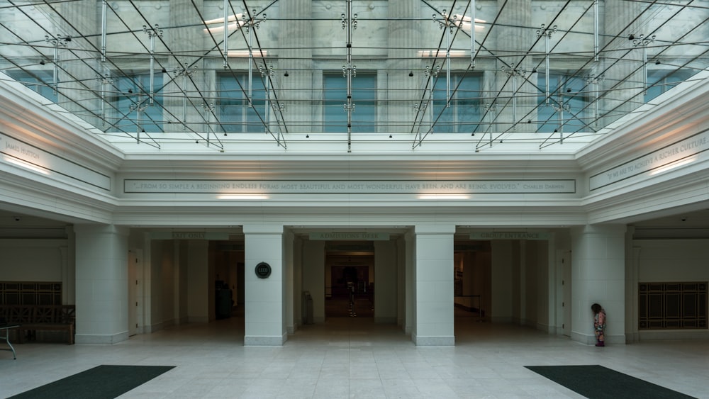 white concrete building with glass windows