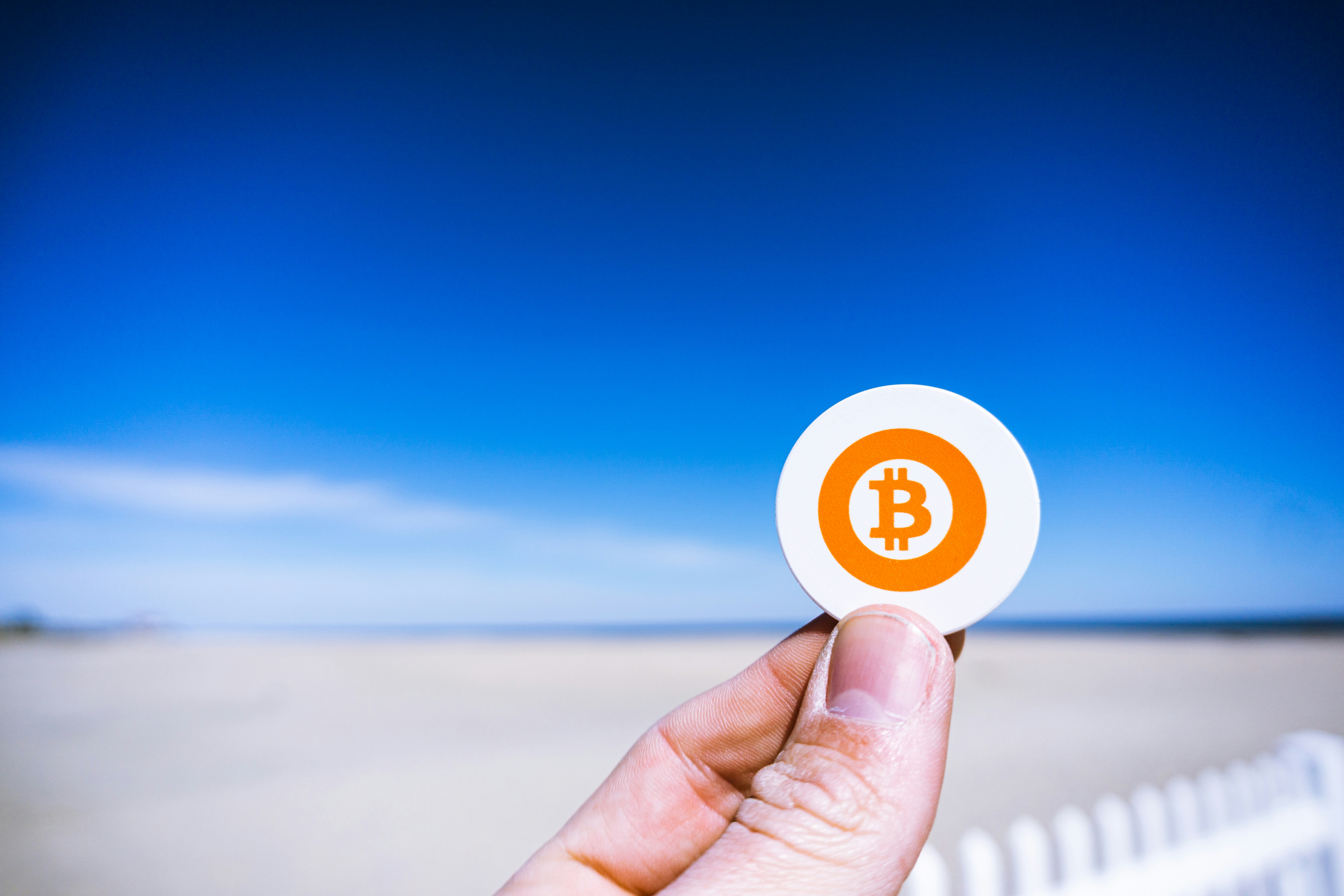 Holding a 'Bitcoin' at the beach