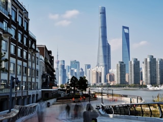 A bustling Canadian city skyline with people commuting to work.