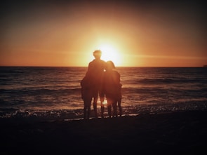 A family enjoying a sunset at a vacation hideaway.