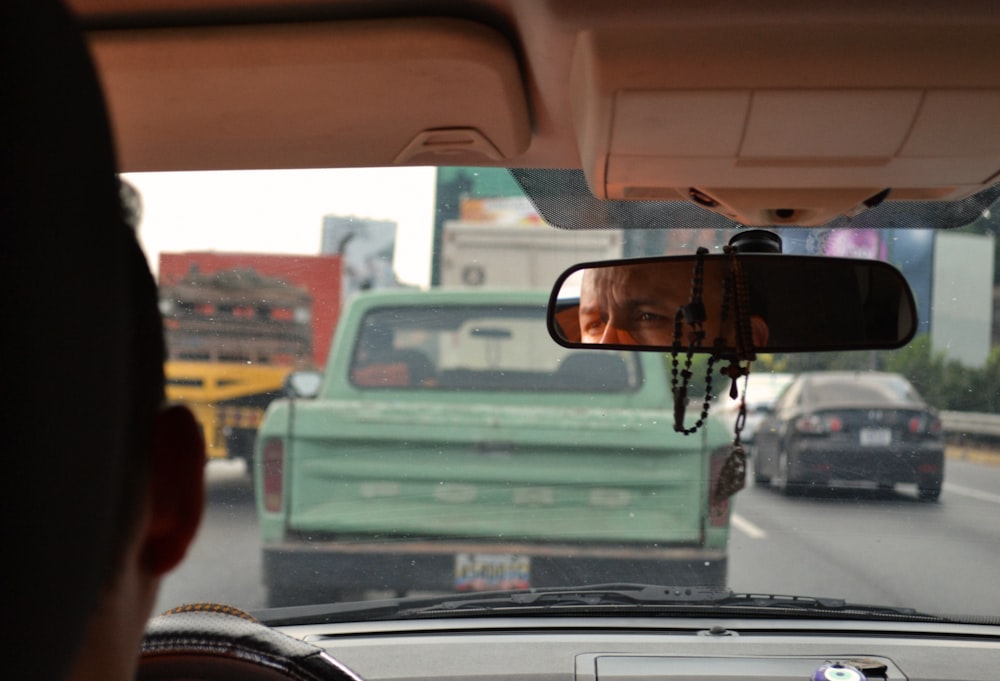 person driving car during daytime