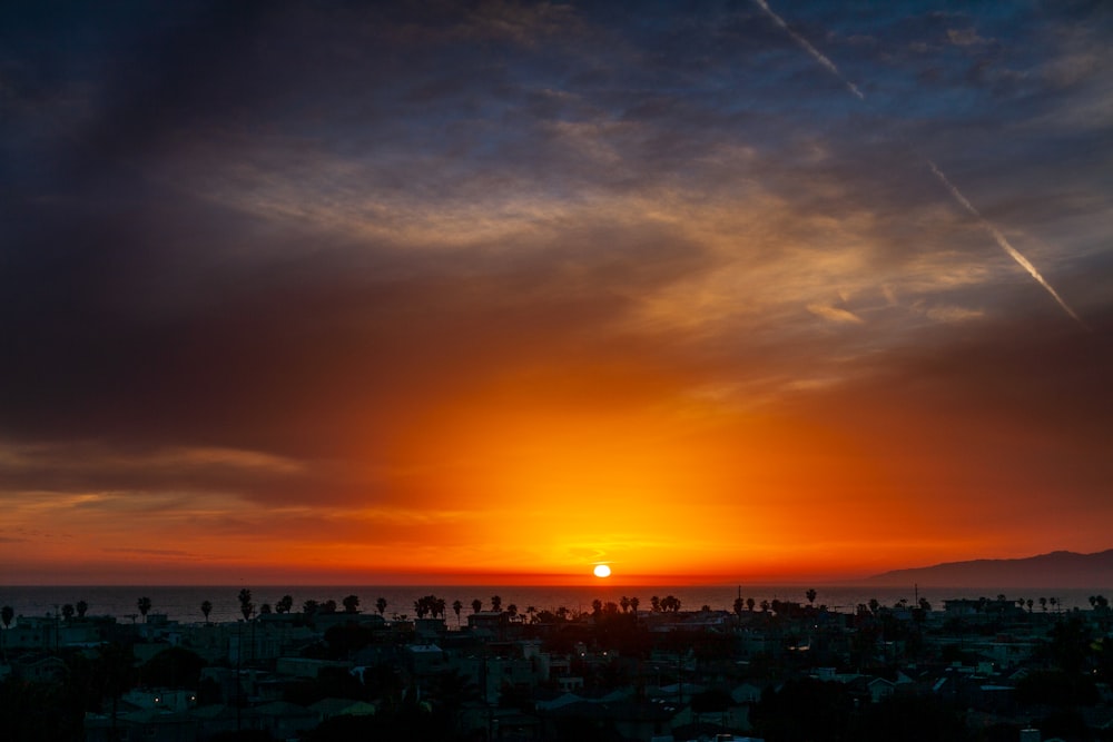 city with high rise buildings during sunset