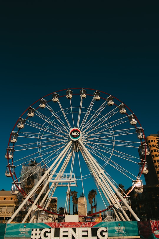 people riding on ferris wheel during night time in Glenelg Australia